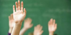 image of student raising hand to ask for help