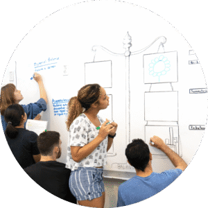 Organising Students BLOG - image of students using a whiteboard to demonstrate
