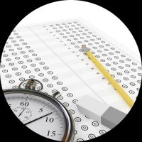 Organising Students BLOG -What Matters Most After Exams? What You Do Next - IMAGE of an exam paper and clock